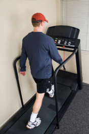 man walking on a treadmill